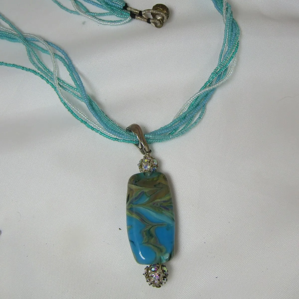 Exotic Aqua Lampwork Pendant on Aqua Seed Bead Necklace